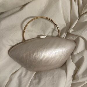 Marble like clutch with gold handle